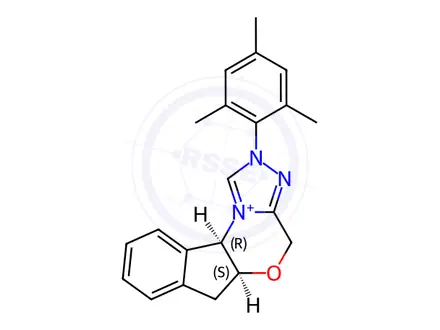 Chemical structure of (5aS,10bR)-2-Mesityl-4,5a,6,10b-tetrahydroindeno[2,1-b][1,2,4]triazolo[4,3-d][1,4]oxazin-2-ium chloride